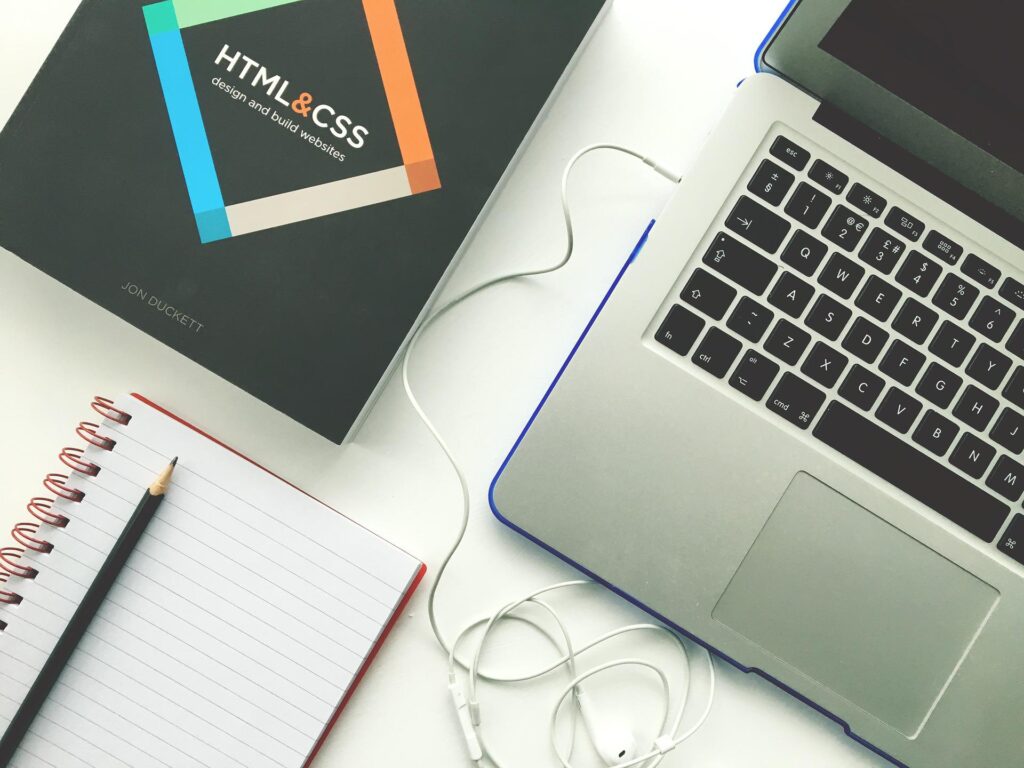 A black html & CSS book with a laptop - Image used by A Better Concept PR
