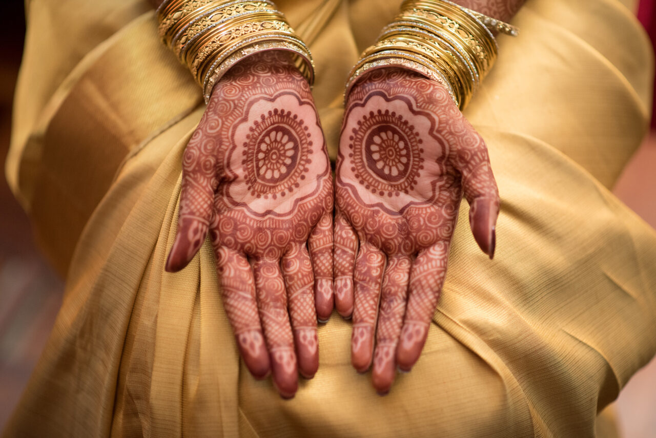 female hands showing henna tattoos